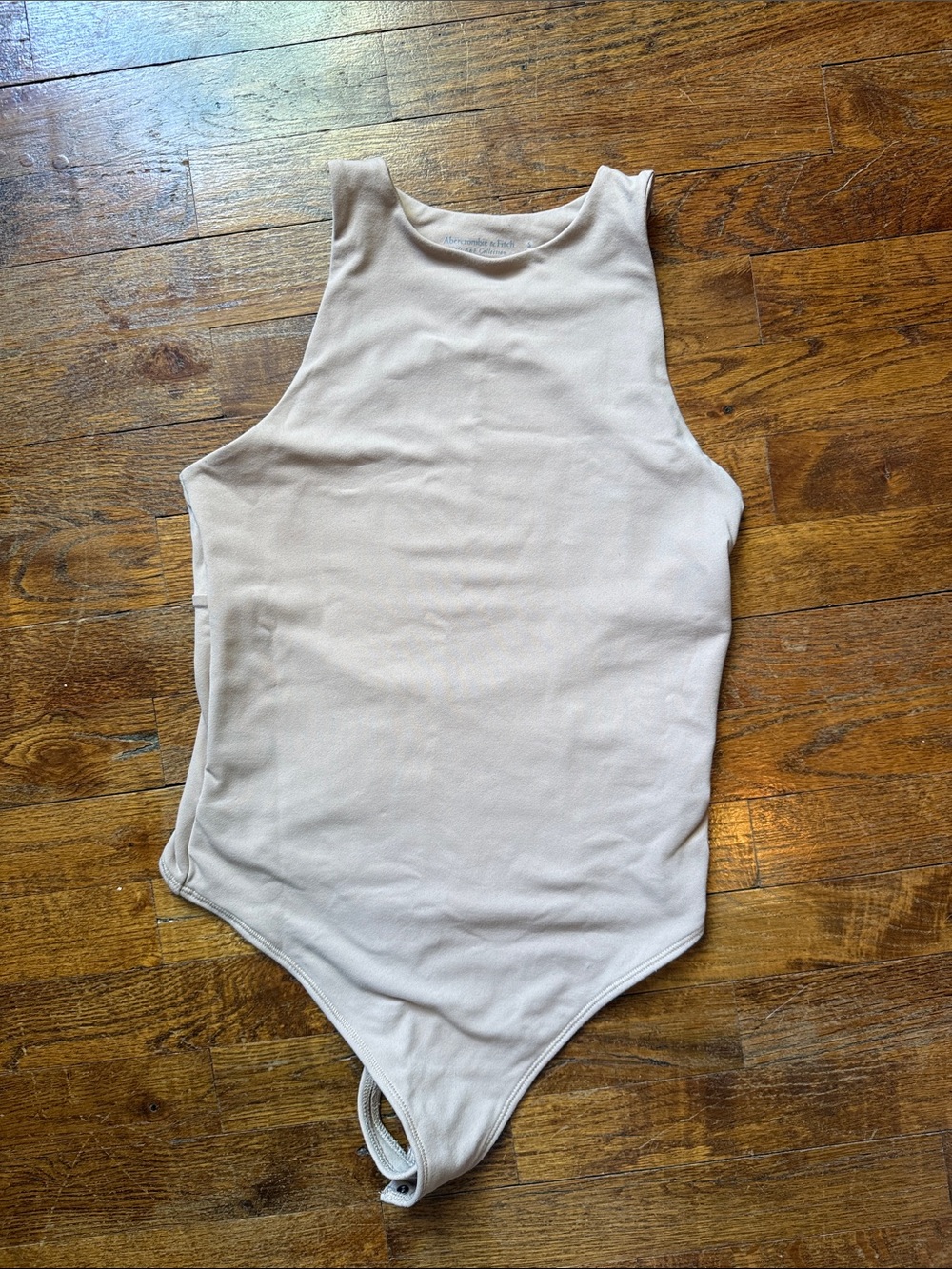 Abercrombie & Fitch Sleeveless Ribbed One-Piece Bodysuit in Light Beige